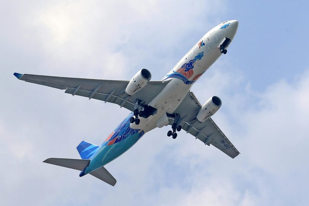 Commercial Airplane in Flight with the Landing Gear Extended