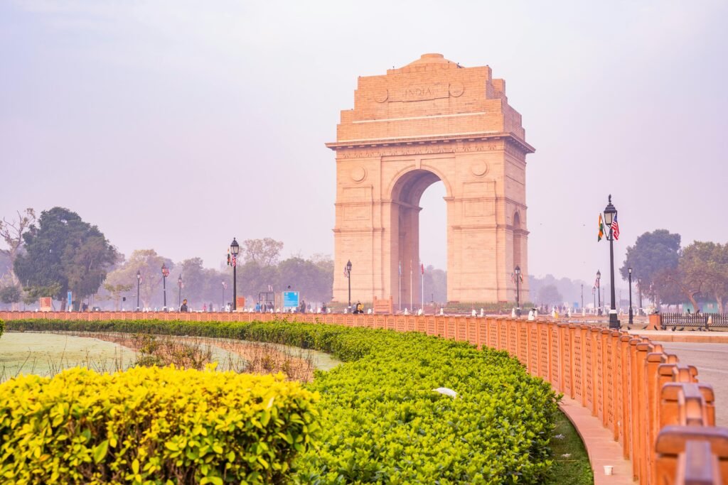 Brown Arch Gate Near Green Grass Field